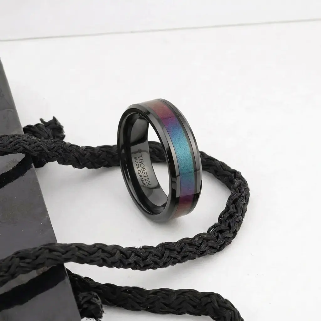Barracuda Black Ceramic Ring With Bevels And Blue Purple Color Changing Inlay